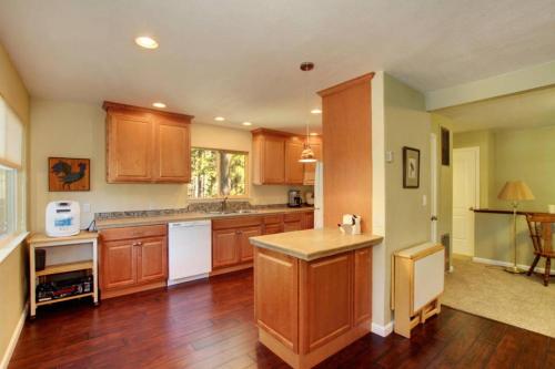 a kitchen with wooden cabinets and a counter top at Ormsby House in South Lake Tahoe