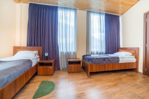 Postel nebo postele na pokoji v ubytování hotel Gallery