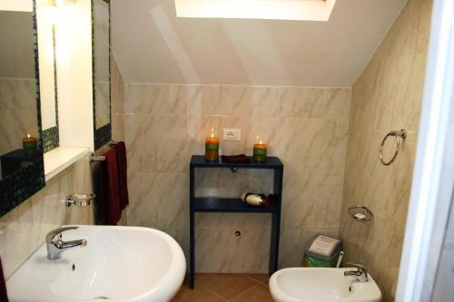 a bathroom with a sink and a toilet at Casa Bahia 11 in Santa Maria