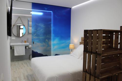 Cama o camas de una habitación en Apartamentos Zarautz Centro