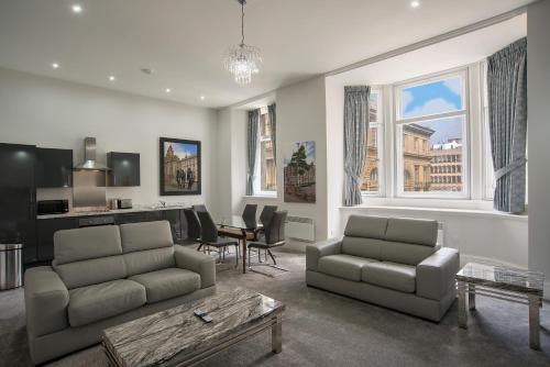 a living room with a couch and a table at The Castle Collection - 42 Castle Street in Liverpool