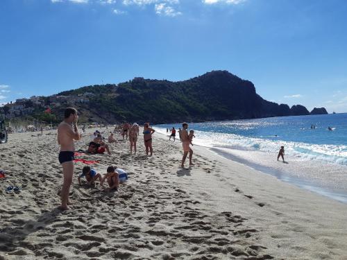 a group of people playing on the beach at Riviera Zen Hotel Adult Only in Alanya