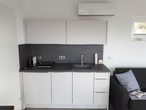 Kuchyň nebo kuchyňský kout v ubytování Appartement Hareter