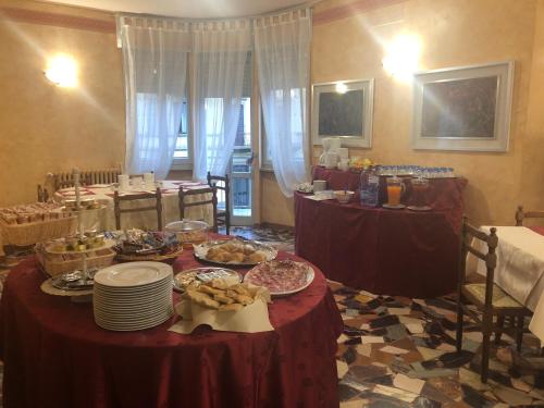 a room with a table with plates of food on it at Hotel Residence Sant'Anna in Bedonia