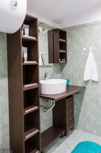 a bathroom with a sink and a counter with a sink at Apartments Nasini by Flat Mаnager in Plovdiv