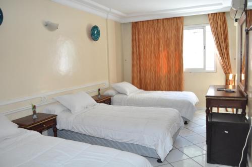 Кровать или кровати в номере HOTEL SALIM