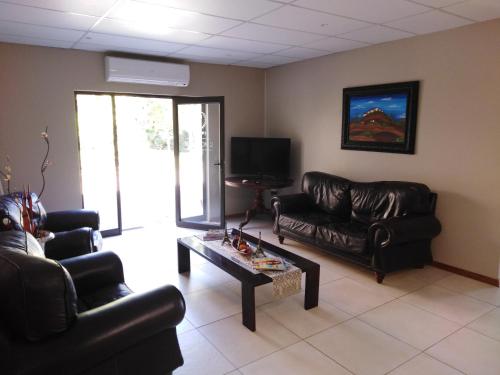 Χώρος καθιστικού στο Vryburg Tuscany Guesthouse