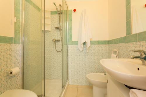 a bathroom with a shower and a sink at Al Ficodindia in Sampieri
