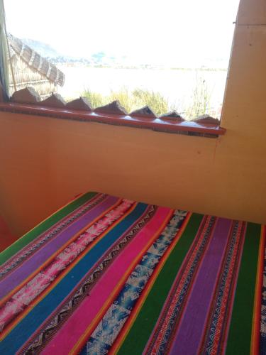 Ένα ή περισσότερα κρεβάτια σε δωμάτιο στο Uros Lodge Lover Titiqaqa
