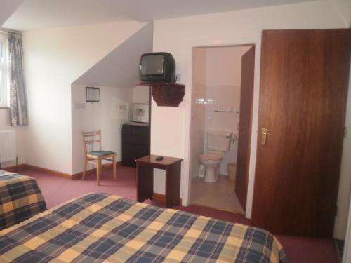 Postel nebo postele na pokoji v ubytování Sancta Maria Hotel
