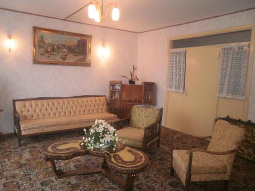 a living room with a couch and chairs and a table at Sancta Maria Hotel in Lahinch