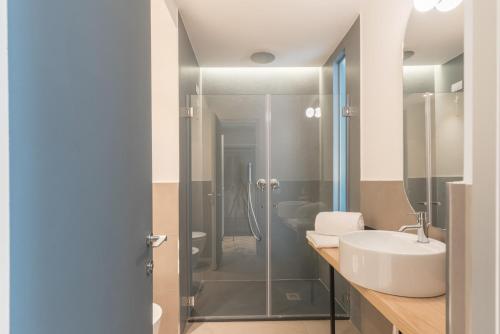 a bathroom with a sink and a shower at Florea Palace in Rome