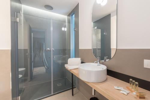 a bathroom with a sink and a shower at Florea Palace in Rome