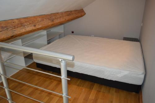 Кровать или кровати в номере Logement Nénuphar