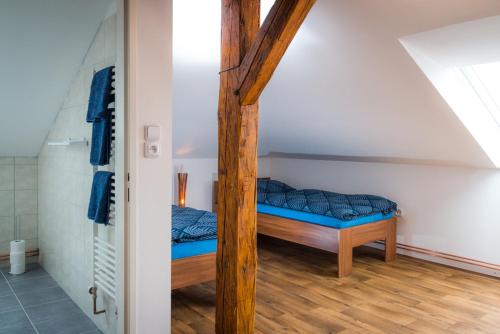 Postel nebo postele na pokoji v ubytování Penzion Sloup