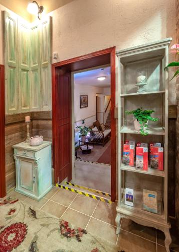 a room with a door open to a living room at Família Vendégház in Szeged