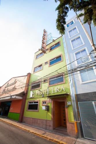 a building with a hotel in front of it at Hotel Lira - Sólo Adultos in Mexico City