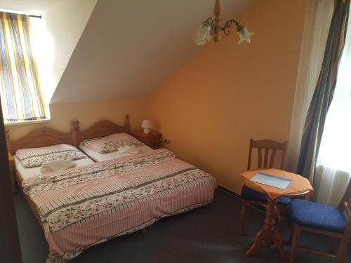 Ein Bett oder Betten in einem Zimmer der Unterkunft Pension Villa Berolina