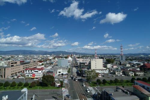 a city view of a city with a blue sky at Hotel Promote Hakodate in Hakodate
