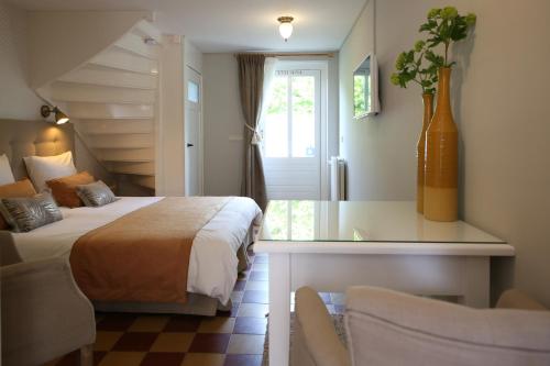 Ένα ή περισσότερα κρεβάτια σε δωμάτιο στο Bed and Breakfast Het Dijkhuis Eersel