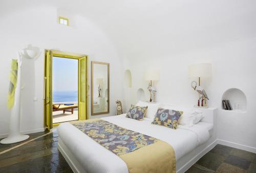Säng eller sängar i ett rum på Ftelari Villa