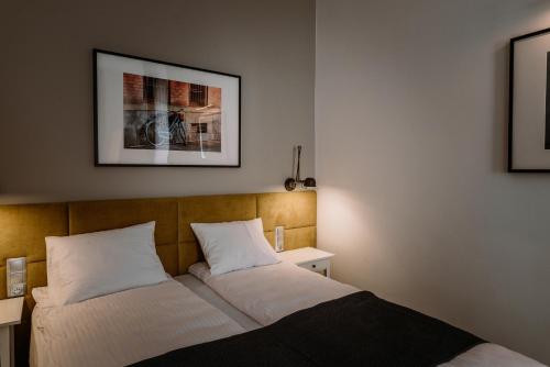 Posteľ alebo postele v izbe v ubytovaní BIKE ROOMS