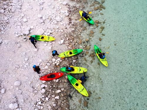 a group of toy kayaks sitting on the ground at Apartma Bubi in Bovec