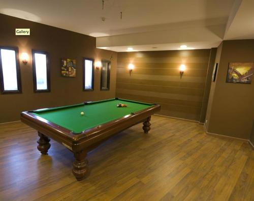 a billiard room with a green pool table at Lotus Bay Resort in Hurghada