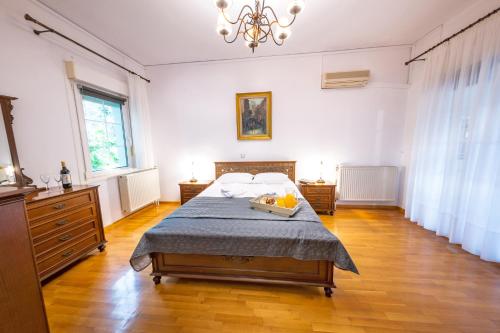 Ένα ή περισσότερα κρεβάτια σε δωμάτιο στο Xenia