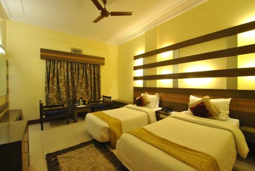 Llit o llits en una habitació de Hotel Siddharth