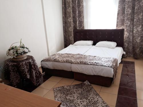 Postel nebo postele na pokoji v ubytování Talaslioglu Hotel