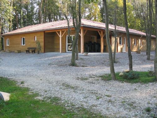 a log cabin in the middle of a forest at Aventure Evasion in Chatuzange-le-Goubet