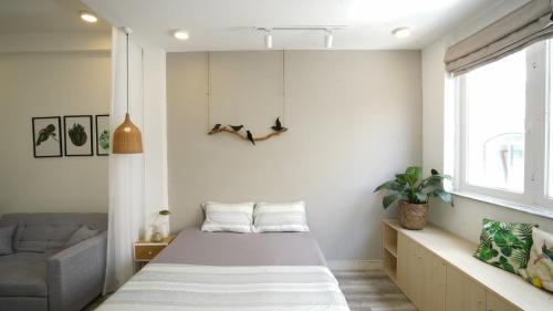 Ein Bett oder Betten in einem Zimmer der Unterkunft Botanic House Saigon