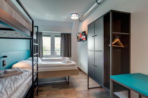 Postel nebo postele na pokoji v ubytování MEININGER Hotel München Olympiapark