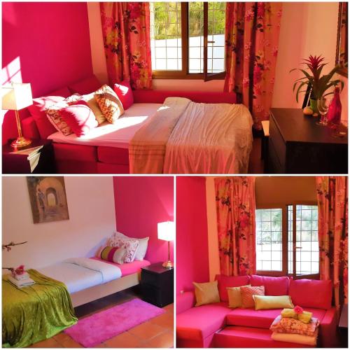 a pink room with a bed and a couch at Ashram Villa Sunshine in Sitges