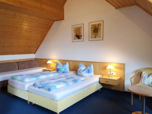Postel nebo postele na pokoji v ubytování Gästehaus Martin