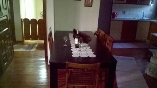 a dining room table with wine glasses on it at VILLA OLGA in Prinos
