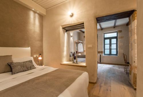 Posteľ alebo postele v izbe v ubytovaní J&G Suites