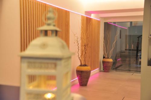 two vases with plants in them in a hallway at Hermitage Resort & Thermal Spa in Ischia