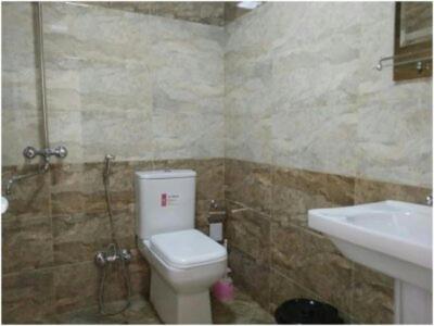 a bathroom with a toilet and a sink at Ilham Mustafa Houses in Sheki