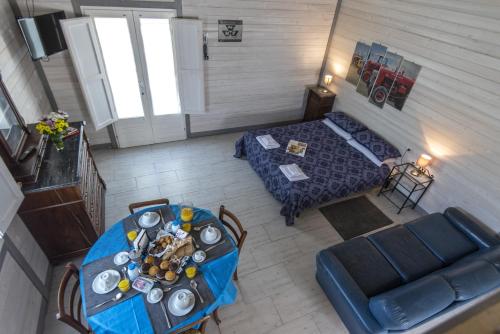 an overhead view of a living room with a table and a couch at Podere Badia Valdrago Agriturismo Mugello Circuit in Scarperia