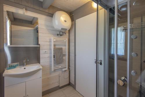a bathroom with a sink and a shower at Podere Badia Valdrago Agriturismo Mugello Circuit in Scarperia