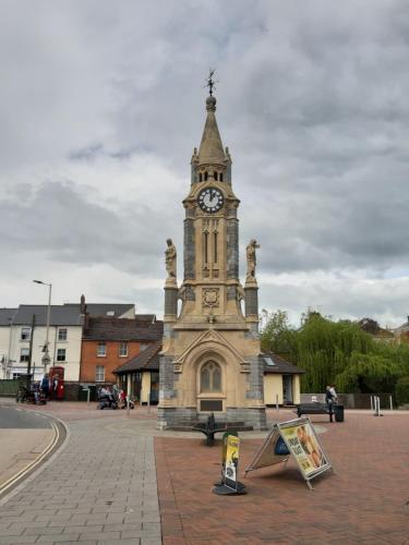 a building with a clock tower in front of it at The Lowman in Tiverton