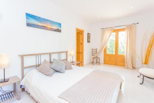Postel nebo postele na pokoji v ubytování Finca Isabel y Guillermo con posibilidad de piscina climatizada