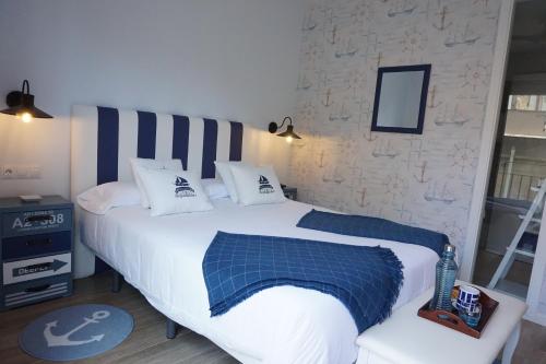 Ένα ή περισσότερα κρεβάτια σε δωμάτιο στο Hotel Boutique OMA
