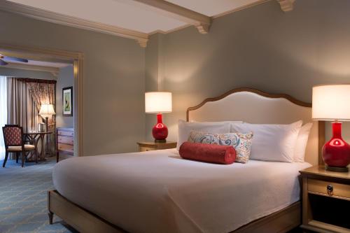 a bedroom with a large bed with two lamps at Hammock Beach Golf Resort & Spa in Palm Coast