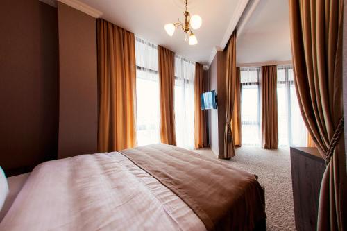 Postel nebo postele na pokoji v ubytování Old Garden Hotel Batumi