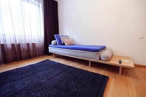 Ένα ή περισσότερα κρεβάτια σε δωμάτιο στο Living In Aparthotel