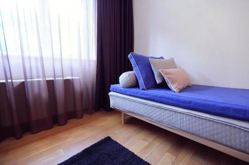 Ένα ή περισσότερα κρεβάτια σε δωμάτιο στο Living In Aparthotel