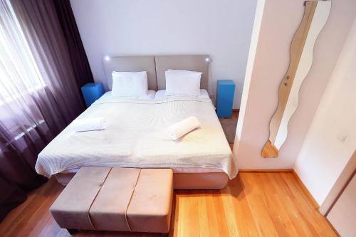 Ένα ή περισσότερα κρεβάτια σε δωμάτιο στο Living In Aparthotel
